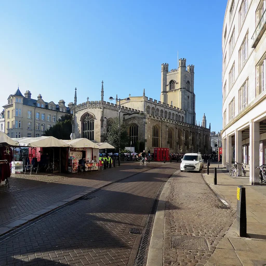 Cambridge Market Square with the tower of Great St Mary's Church, the University Church, rising behind the market stalls