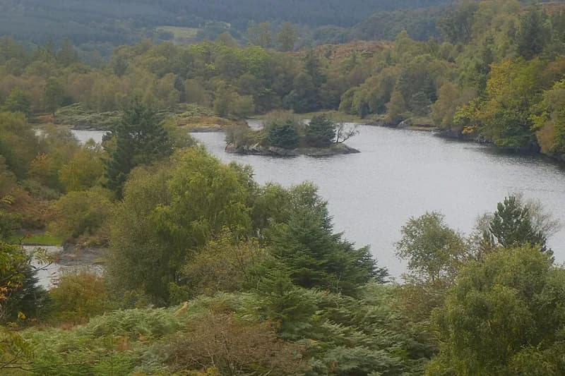 Llyn Elsi and its wooded islands in the Gwydir Forest Park above Betws-y-Coed