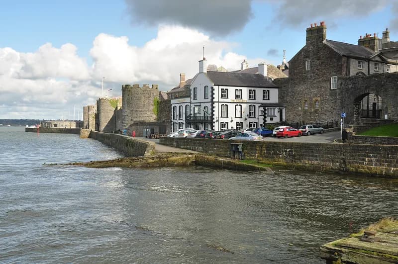 The Anglesey against Caernarfon's west town wall on the harbour