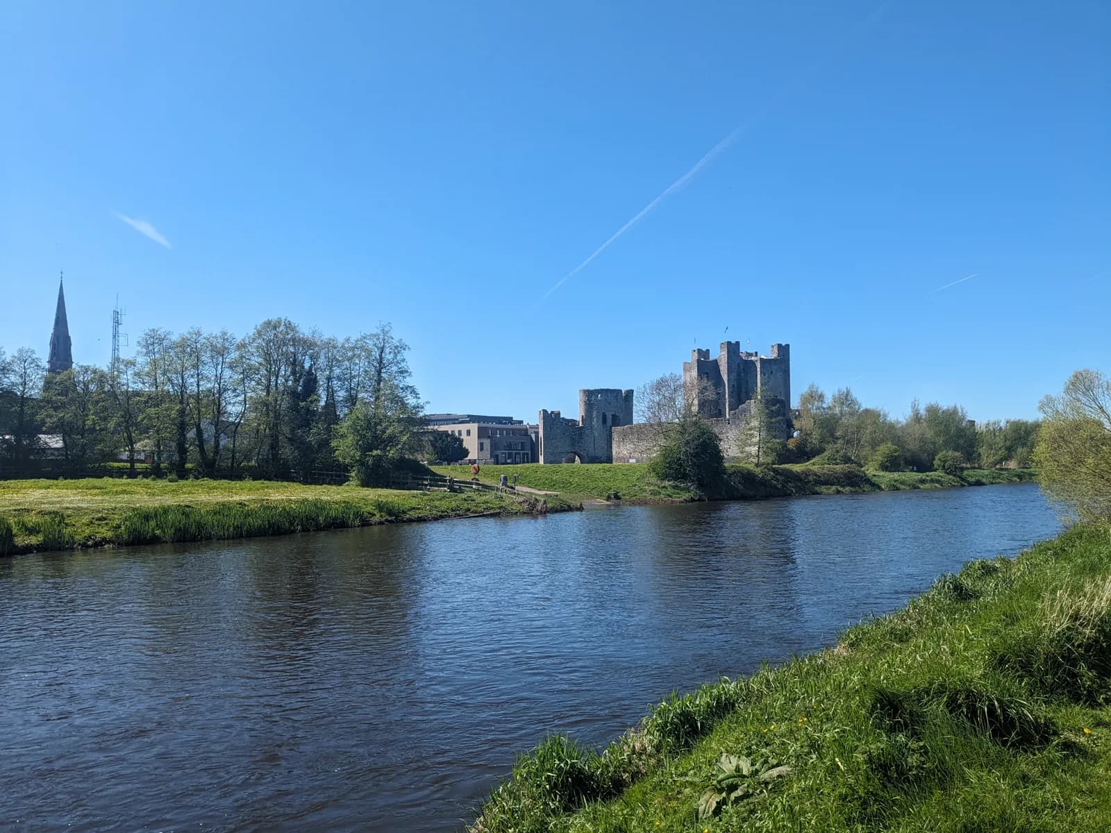 Trim Castle seen across the River Boyne with the spire of St Patrick's church behind it
