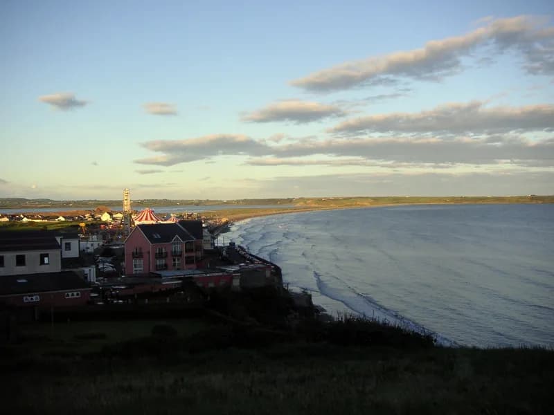 Tramore promenade and the seafront amusements above the strand in the evening